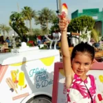 A selection of colorful fruit pops served in Dubai, capturing the joy of families choosing refreshing alternatives to ice cream.