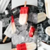 Assorted Pop City popsicles on ice, including coconut, piña colada, and strawberry lemon flavors, perfect for a Dubai beach day.